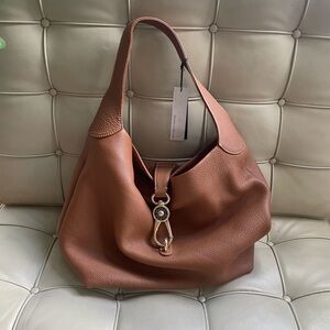Dooney & Bourke Leather Lock Sac in Camel